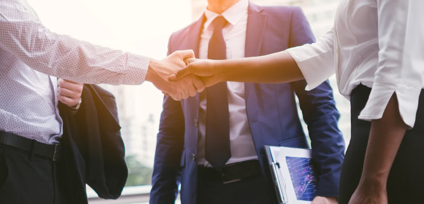 Hand shaking business people representing corporate governance