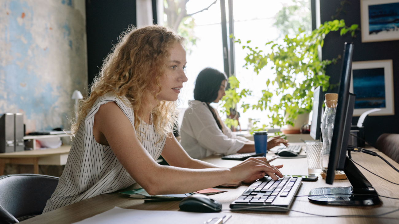 Grant Management Administration Services with woman at desk
